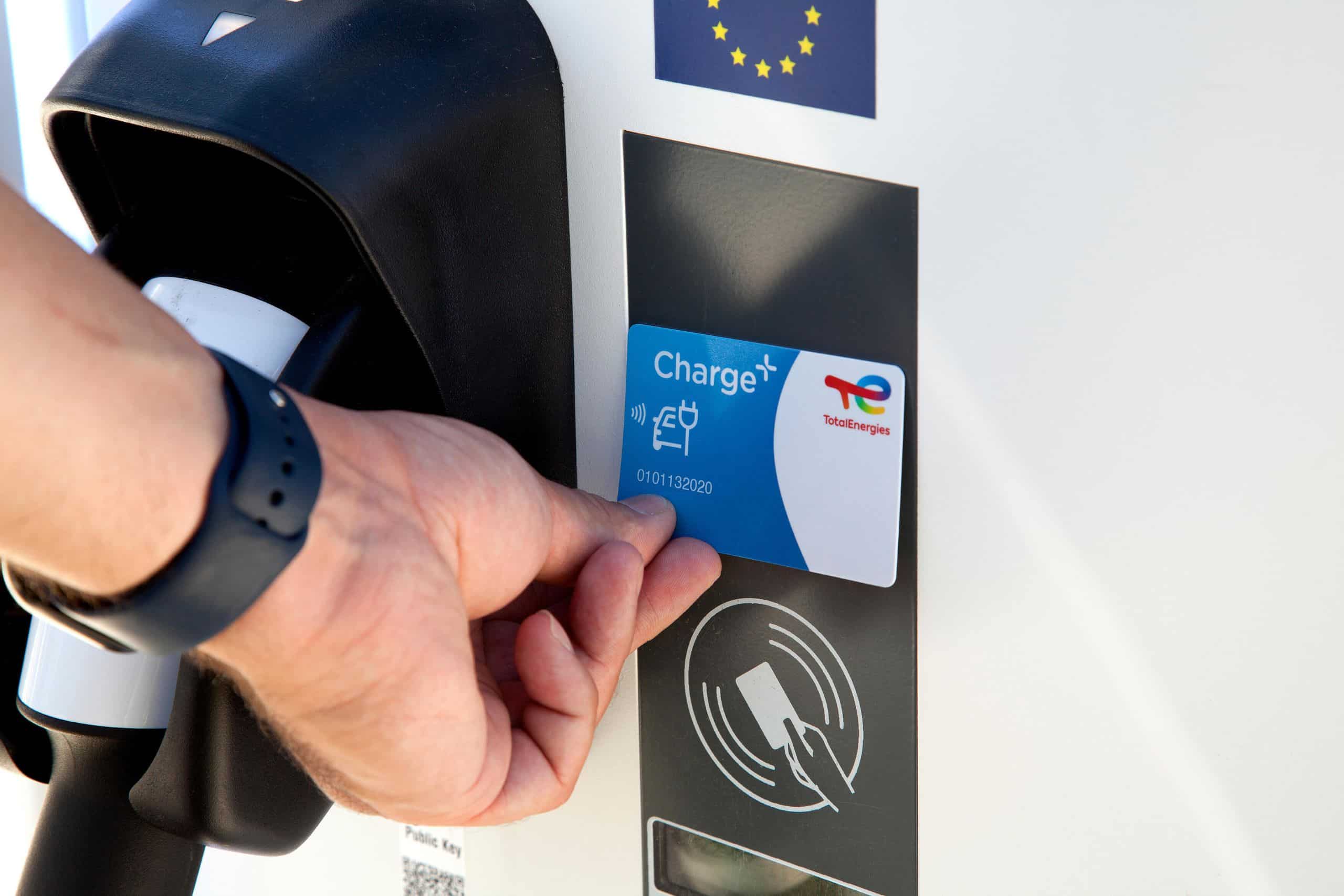 Person scanning their charge card