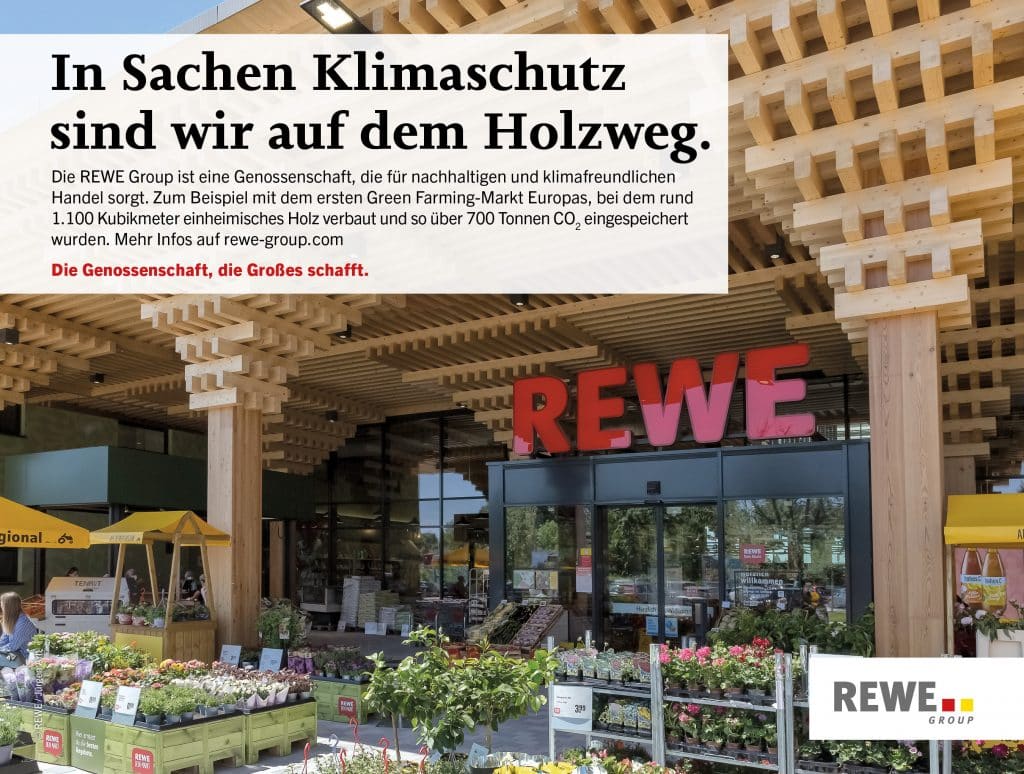 Greenbuilding von REWE mit Pflanzen die zum Verkauf angeboten werden und dem Schriftzug 