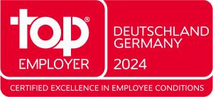 Logo von Top Employer Germany 2024. Weiße Schrift vor rotem Hintergrund.
